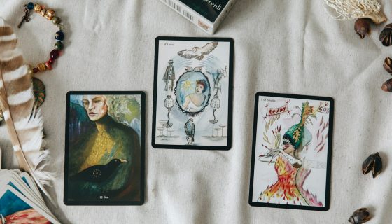 2 black and white cards on white textile